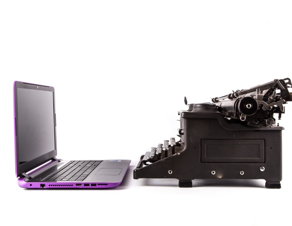Large typewriter and laptop