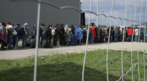Homepage 1200px a line of syrian refugees crossing the border of hungary and austria on their way to germany. hungary  central europe  6 september 2015