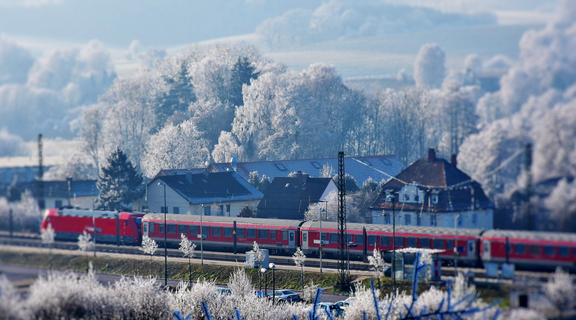 Homepage canva   train station in snowy landscape